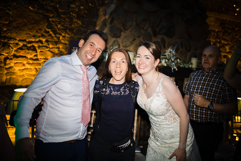 arienne-jonas-with-bride-groom-end-of-a-wedding-day-at-ash-tree-barns-aj-feather-photography