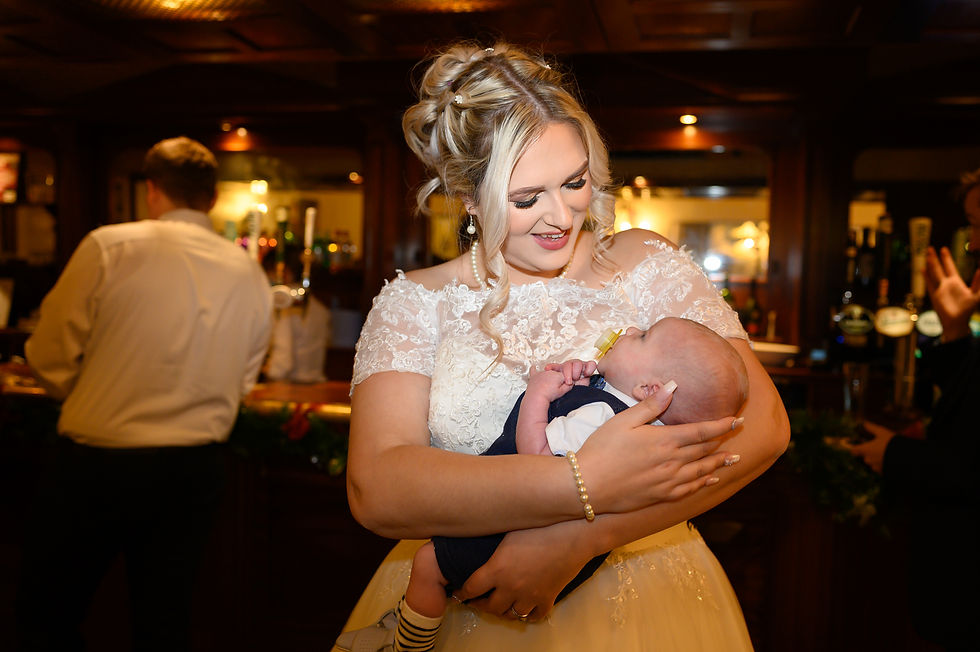 aj-feather-photogrpahy-christmas-wedding-dunston-hall-norwich-bride-cuddling-baby