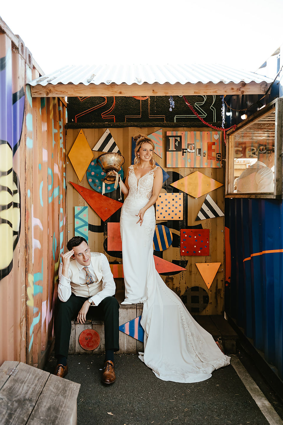 bride and goom on the podium after playing crazy golf