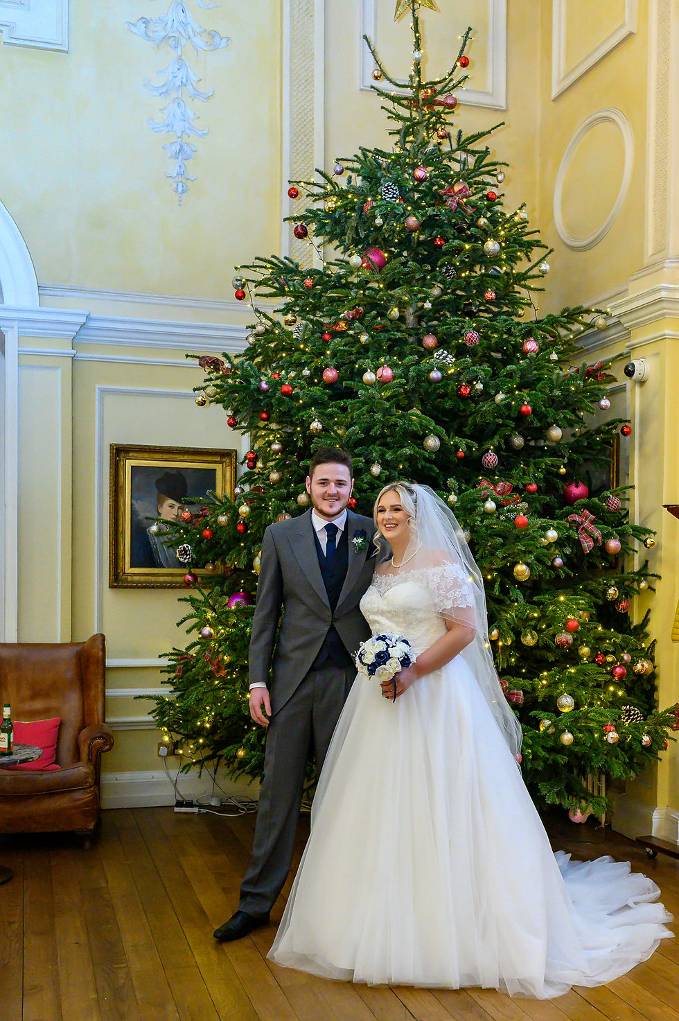 aj-feather-photogrpahy-christmas-wedding-assembly-house-norwich-couple-infront-christmas-tree