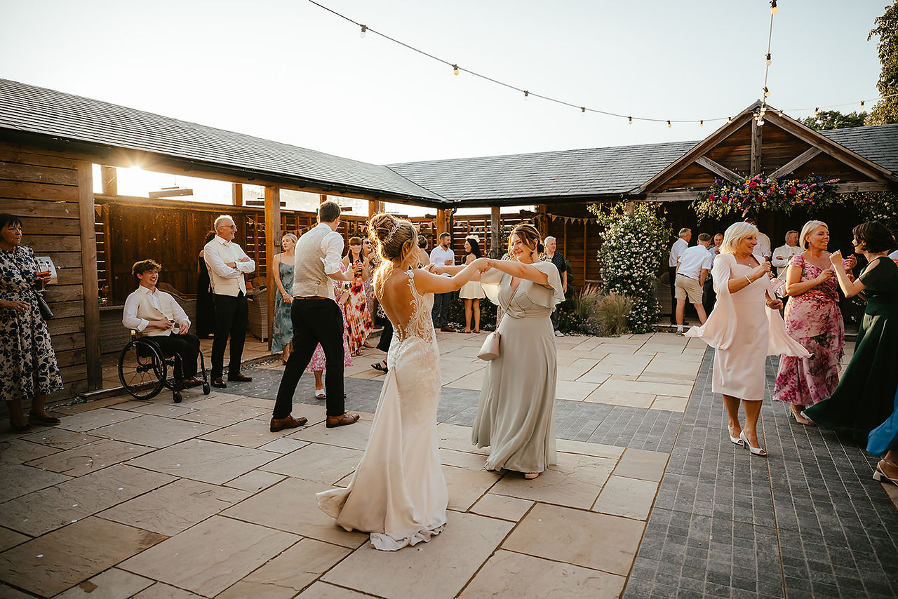 guest dancing at the stables evening madness sunset courtyard