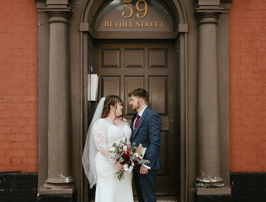 bride-and-groom-in-querky-door-way-in-norwich-norfolk