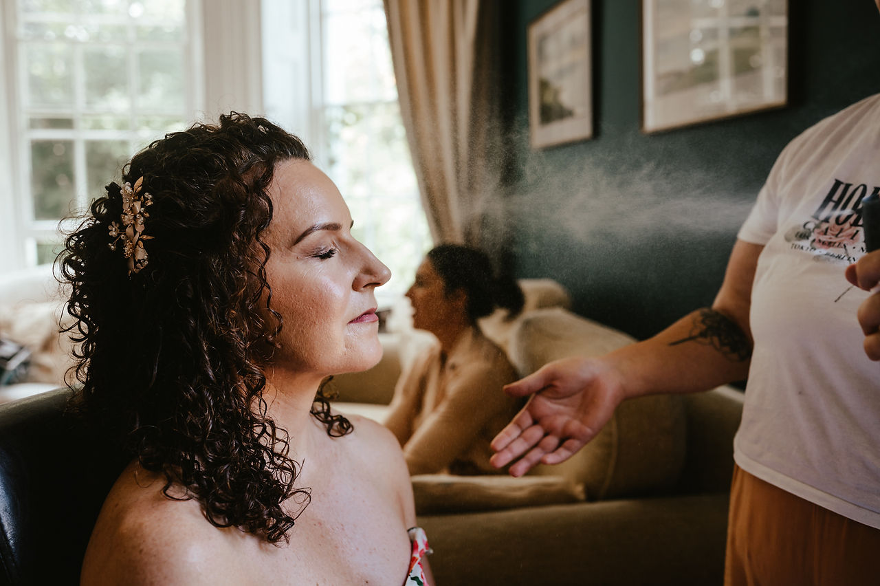 ajfeather-photography-wedding-photographer-norfolk-norwich-the-grove-cromer-bride-getting-makeup-finished-boho-beauty-box