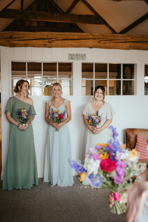 girls all crying as they see the bride for the first time.