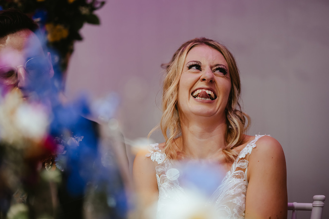 bride laughing at bestman speech