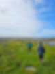 FTLO travelers enjoying a countryside walk amidst the rolling hills of Glencoe