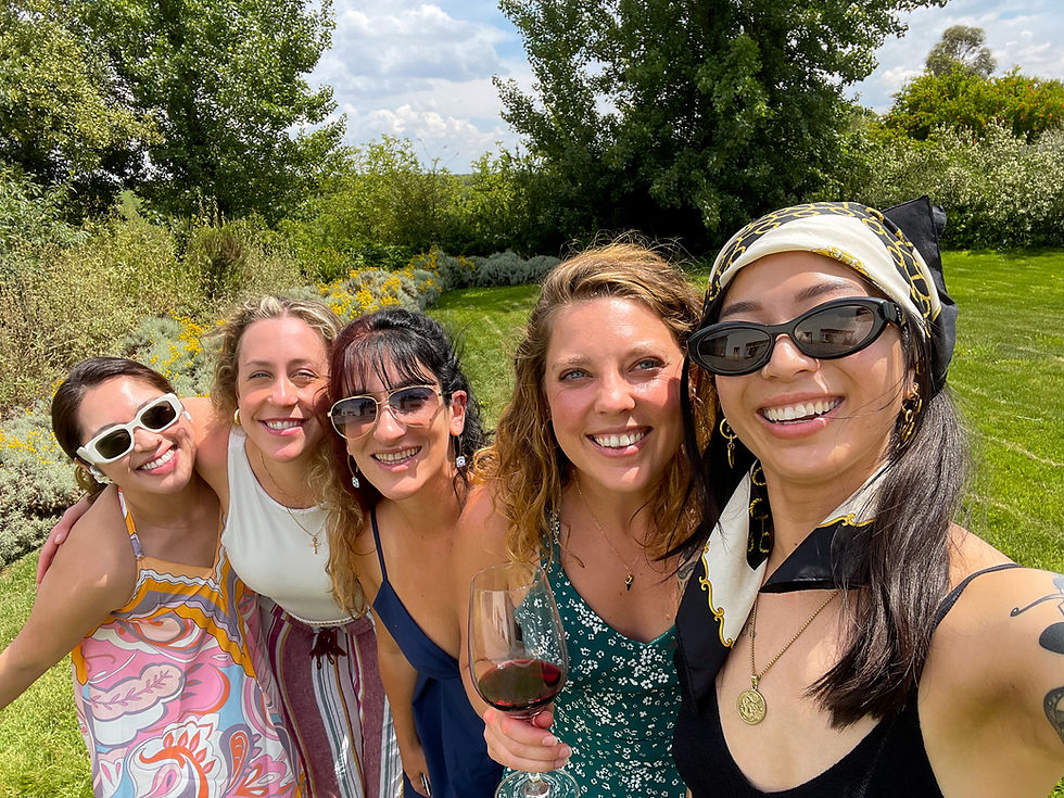 Group of girls travel to a vineyard.