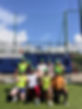 FTLO travelers participating in a Gaelic games experience on a sunny day in Ireland