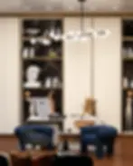 Modern office interior design with armchairs and bookshelves