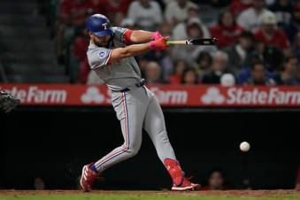 Rangers score four runs in ninth to beat Angels 9-8