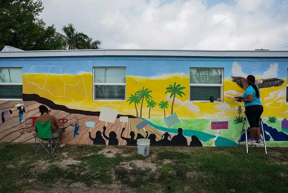 Alejandra Ramírez, 40, left, and Norma Pérez, 34, right, paint a mural at the LUPE office. Credit: Verónica Gabriela Cárdenas for The Texas Tribune