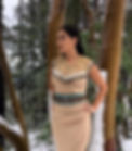Shoshoni wearing a beaded cape and belt
