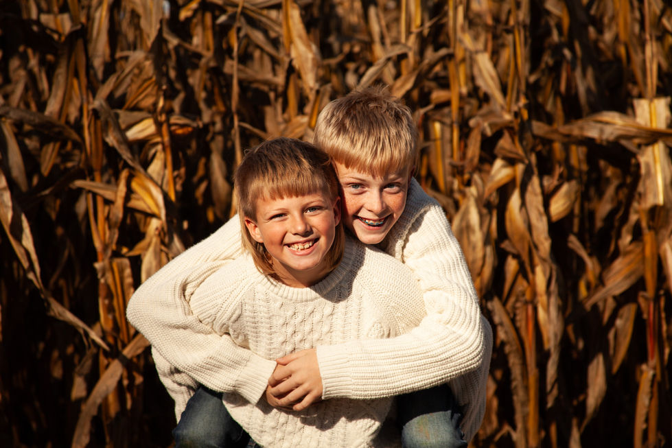 Photo of two boys hugging each other.