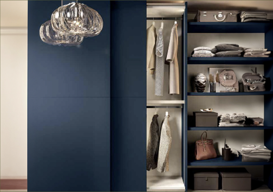 The walk-in closet exudes luxury with its elegant design and closed side panels. The space is highlighted by deep blue cabinetry and open shelving, which provide a sophisticated and contemporary aesthetic.
NJ