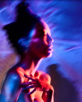 Creative portrait by Dan Cotton in Maidenhead, London - projected colour, motion blur and an emotional moment collide in a cinematic image