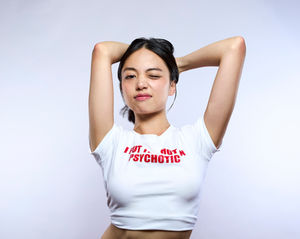 Personal Branding portrait by Dan Cotton near London - fresh, cheeky expression in slogan tee in bright studio light