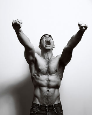 High energy creative portrait by Dan Cotton in Maidenhead, Berkshire - bare chest shout, power, release, black and white