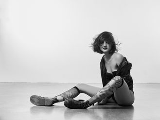 Creative portrait by Dan Cotton Photographer in Berkshire: ripped clothes, raw feel, black and white