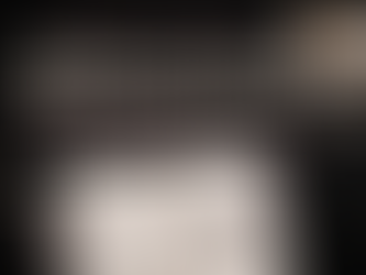 Flat-lay promotional graphic on a black background featuring a planner with a checklist, pen, smartphone, coffee cup, and house keys. The text reads “Elevate Your Business: 20 Winning Habits for Real Estate Professionals” in cream and muted rose tones.