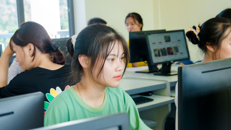 Student working at a computer in a classroom