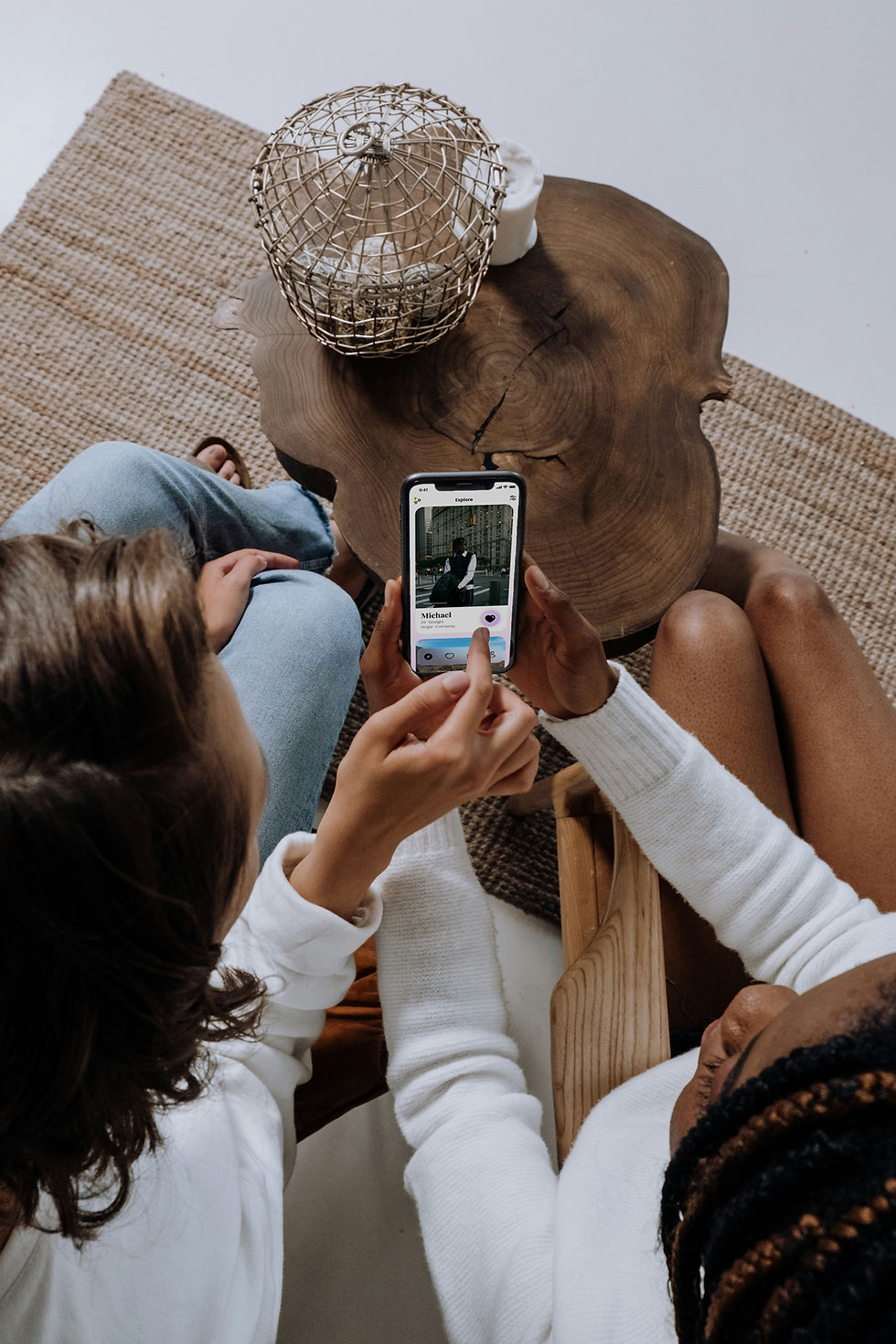 Two people swiping through dating apps