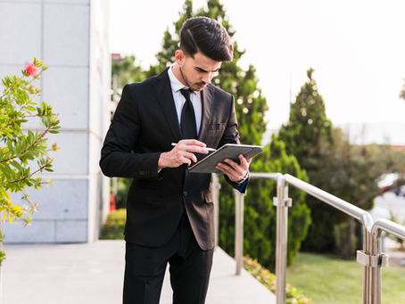 A young businessmen searching on his tablet this image is featured on the blog of Jaseem, the best freelance digital marketing  specialist in Kerala about how ai transforming the future of growth and innovation
