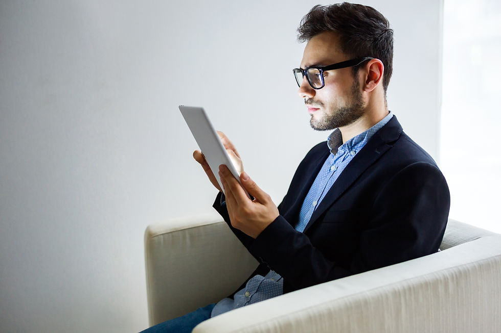 An image of a person searching on his tablet this pictute is featured on the blog of Jaseem, the best SEO specialist in Kerala about how google ai content verification will change seo and digital trust