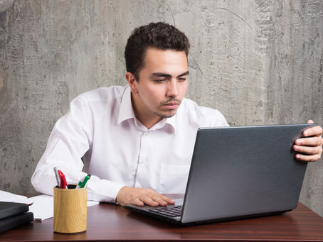 A person searching on his laptop, this image is featured on the blog of Jaseem, the best SEO specialist in Kerala about google's feature google ai search opt-out