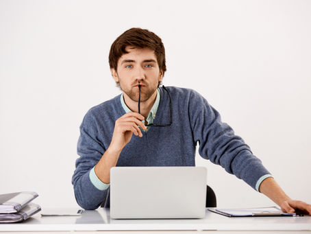 A person searching on his laptop and also thinks about it is right or wrong this image is featured on the blog of Jaseem, the best freelance digital marketing specialist in Kerala about an blog of AI literacy