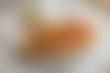 Hyderabadi Mixed Chicken Biryani in handi with salan and raita, showcasing the affordable quality of Mehfil Biryani.