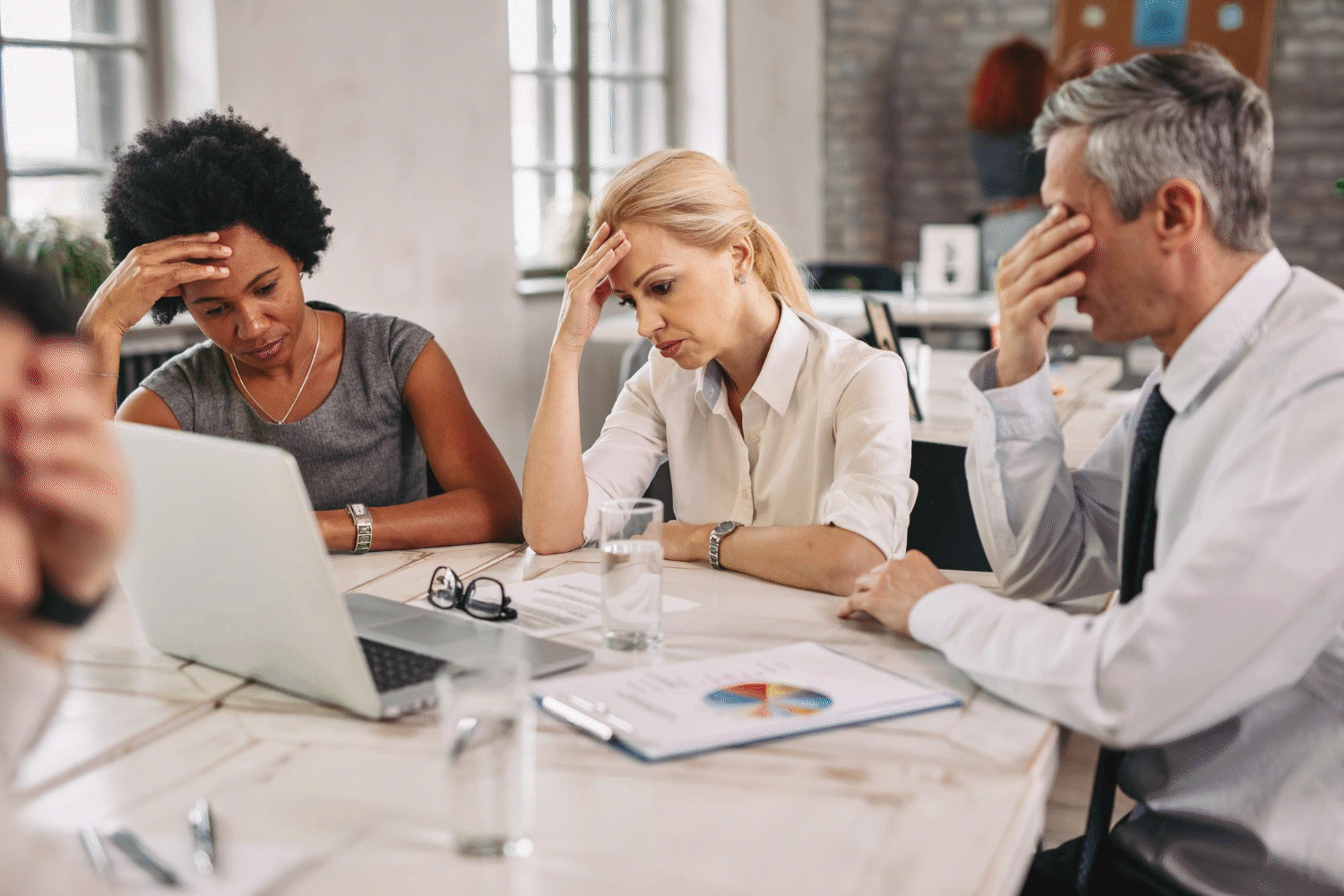 Before and after images of three people at work. In the first they are frustrated. In the second they are applauding.