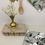 Miniaturbild: Quadratischer Topflappen mit Magnolien und Messingöse