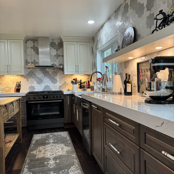 
Warm painted and wood tone kitchen cabinetry designed by Driftwood Cabinet Design Fort Walton Beach Florida. 850.499.8180
