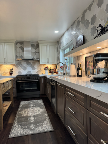 
Warm painted and wood tone kitchen cabinetry designed by Driftwood Cabinet Design Fort Walton Beach Florida. 850.499.8180
