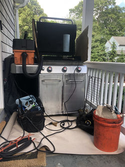 The BarbeQue Grill Guy of New York Area. Cleaning A Weber Grill in a tight spot on deck
