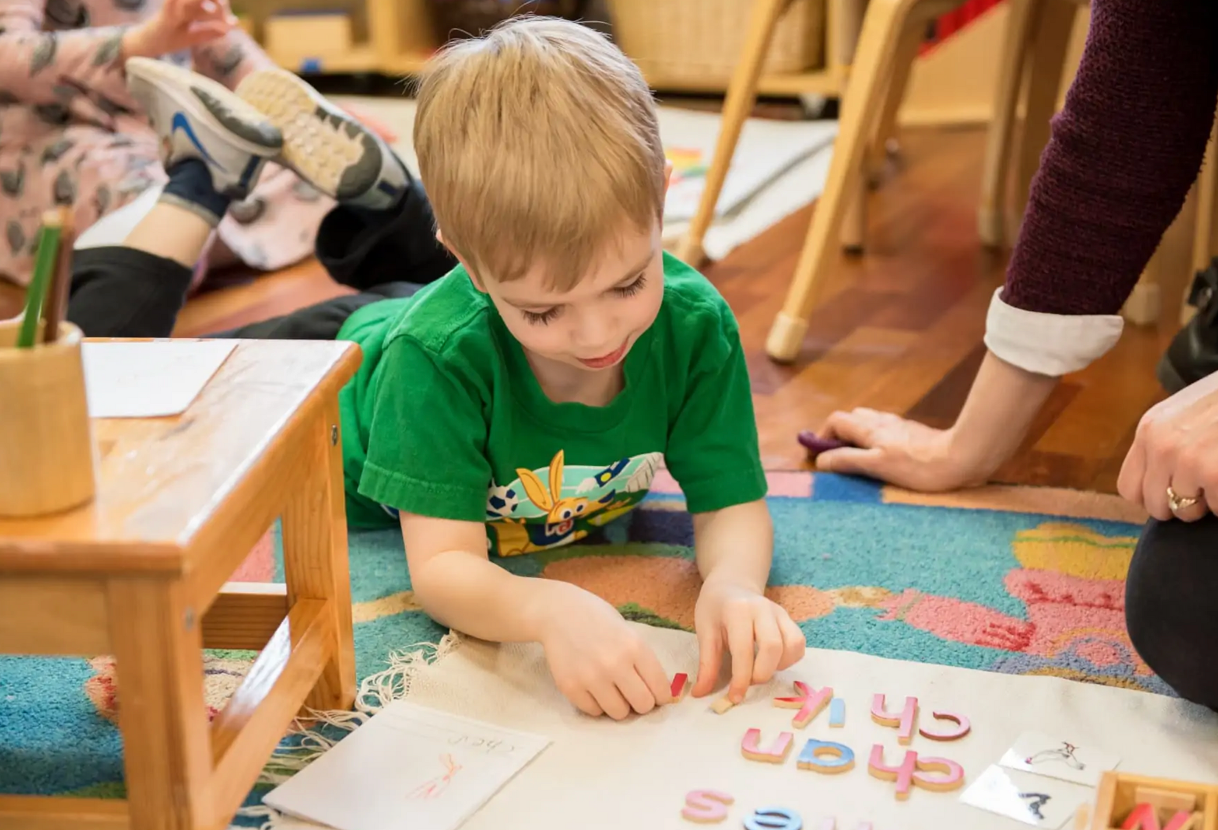 A Village Green Montessori Inc logo