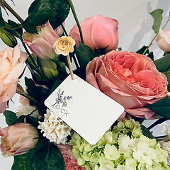 a pick original floral arrangement with the pick card inside