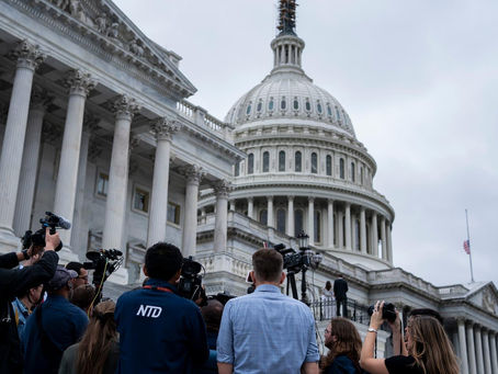 Members of the press outside the U.S. Capitol.