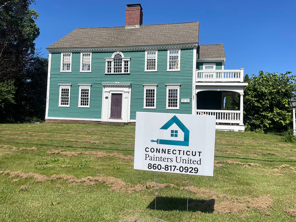 Freshly stained colonial with vibrant sea foam green-blue and our yard sign proudly displayed — quality work you can trust from Connecticut Painters United.
