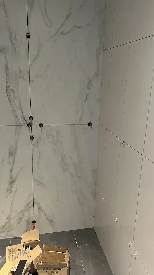 Tiles being installed for the bathroom