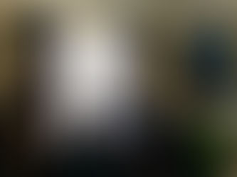 Attorney Ashley DeBoard meeting with two women and a man in a dark office - lighting is moody the tone is serious