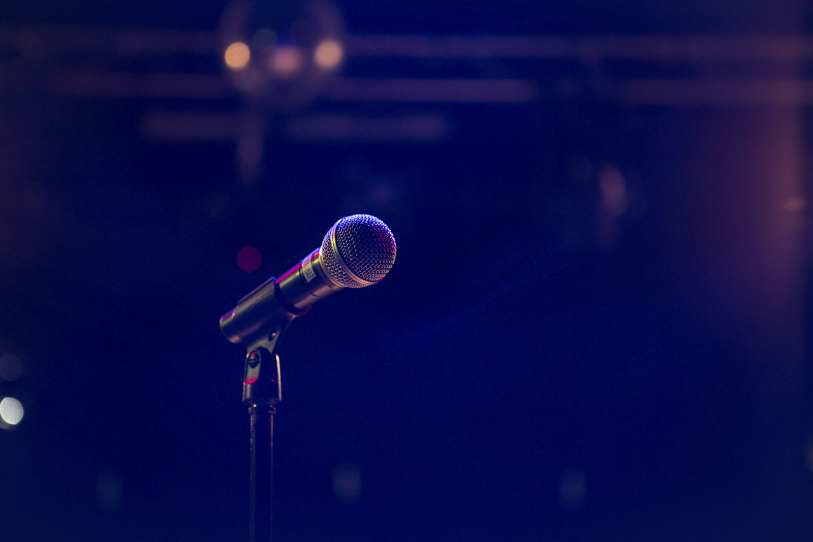 A microphone on a stand, ready for an announcement
