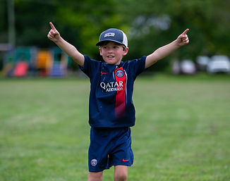 Player celebrating after scoring a goal at our school holiday activities
