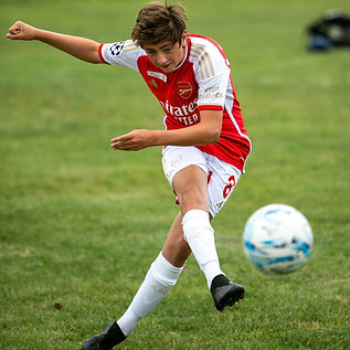Player striking the ball at our school holiday activities