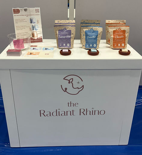 The Radiant Rhino trade show booth at NY NOW in New York City displaying Tranquility, Breathe, and Elevate shower steamer products