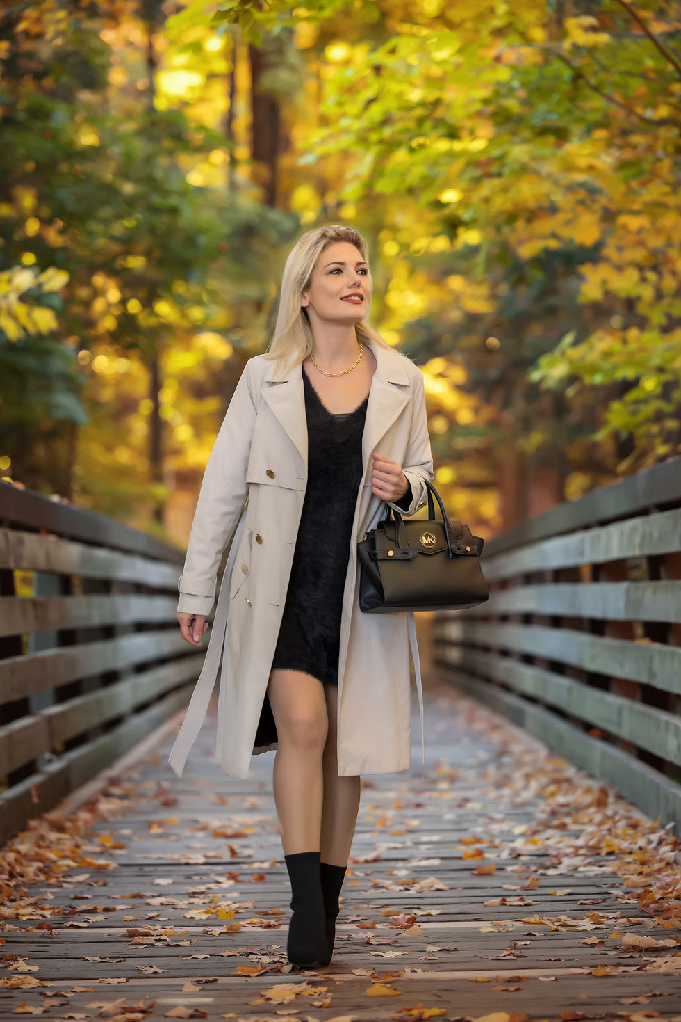 Outdoor fashion photoshoot Toronto on bridge with coat and fall scenery