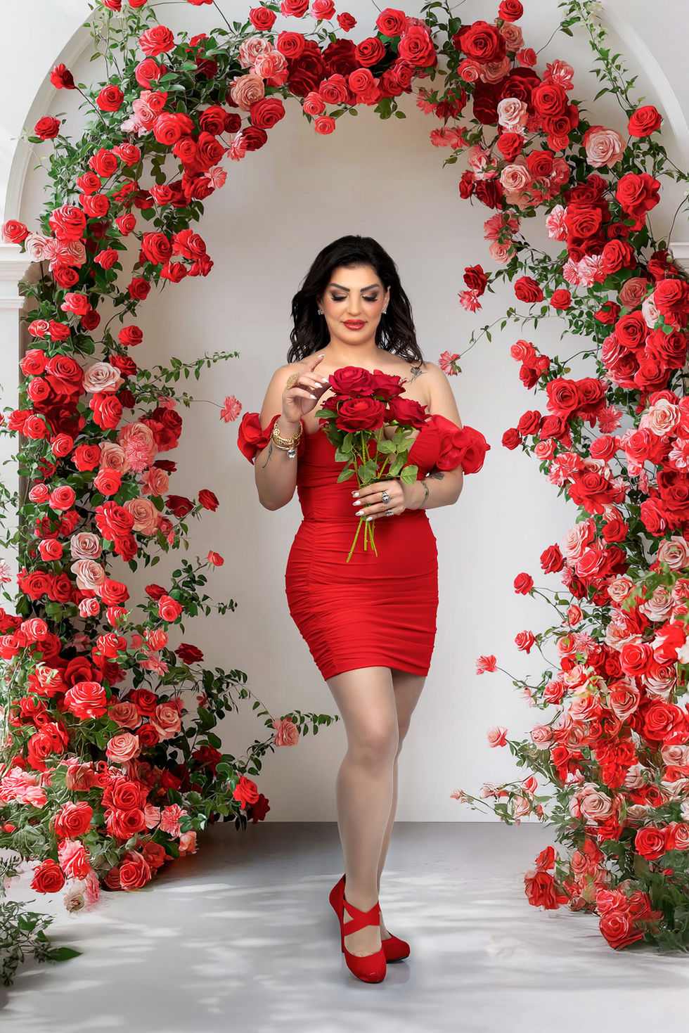 Artistic portrait photography Toronto with red dress and red floral backdrop