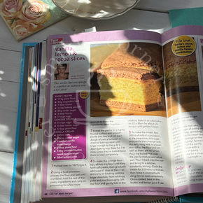 Honey Lemon Vanilla Cake, cocoa layers, lemon vanilla cream and soft sponge.