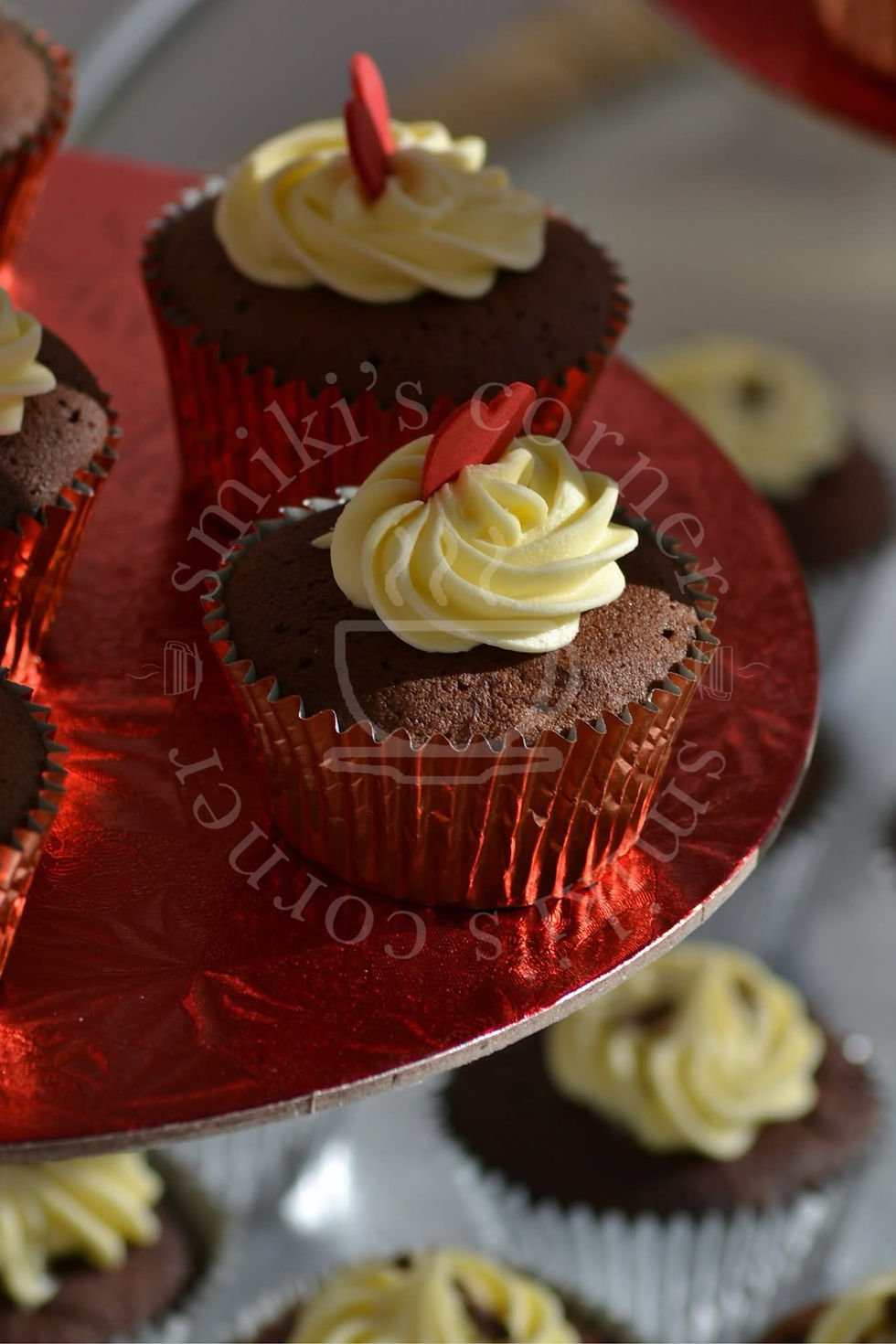 Close up of a single Chocolate Fudge Valentine cupcake topped with a mini vanilla buttercream rosette.