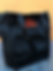 Black tote bag with Holy Smokes embroidered in red and orange letters